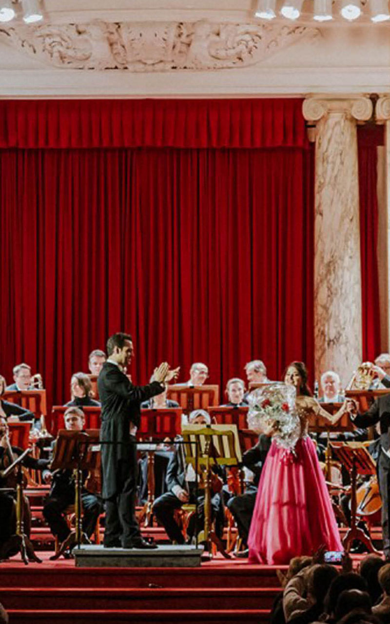 Orchestra performance in grand concert hall