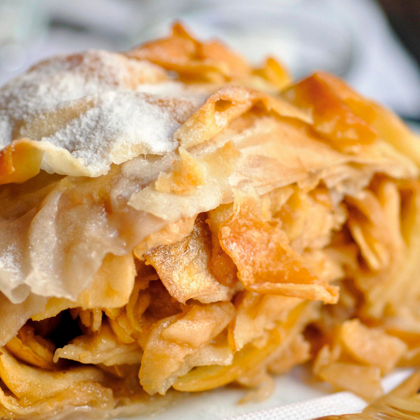 Golden apple strudel with powdered sugar