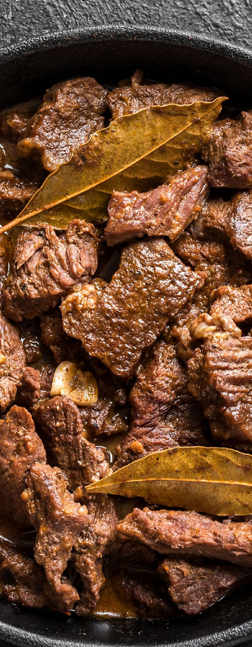 Braised beef stew in cast iron skillet