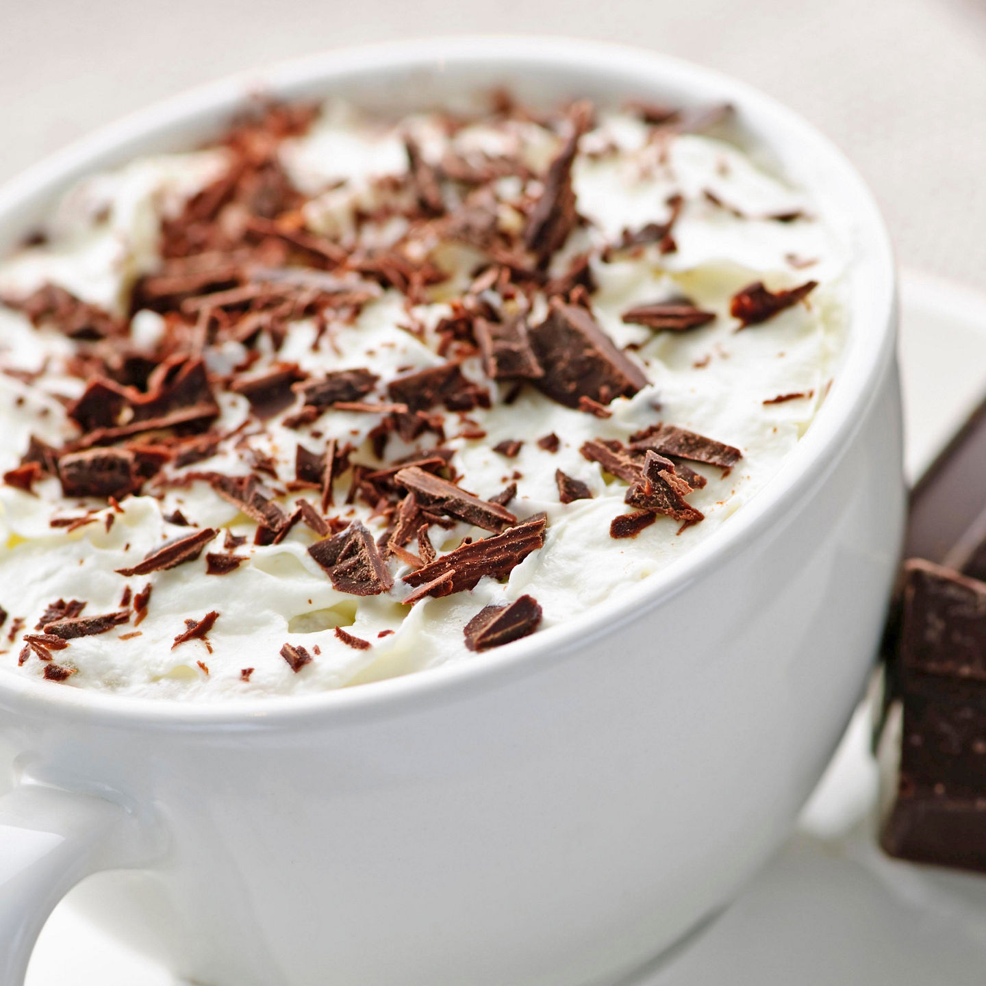 Hot chocolate with whipped cream and chocolate shavings