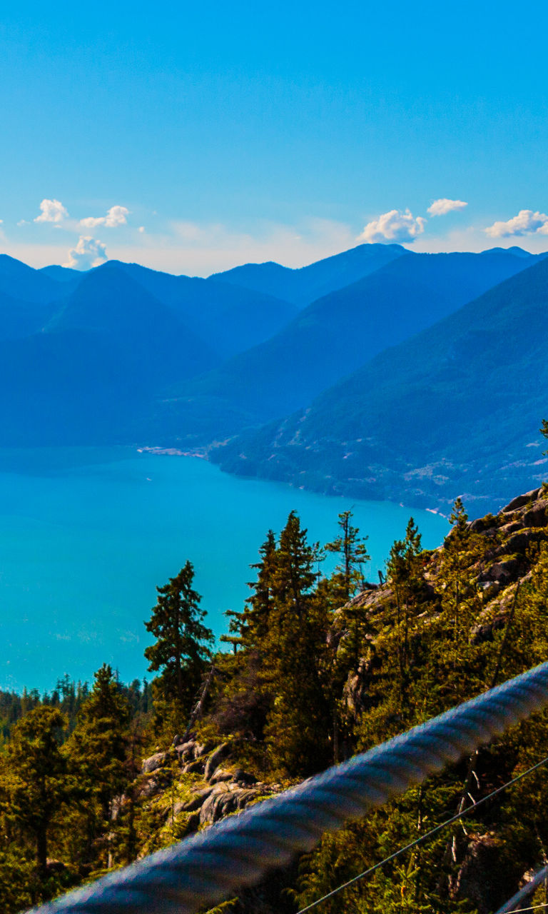 Scenic suspension bridge overlooking mountain lake