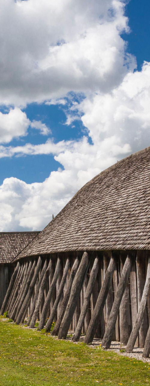 Historic wooden structure under cloudy sky