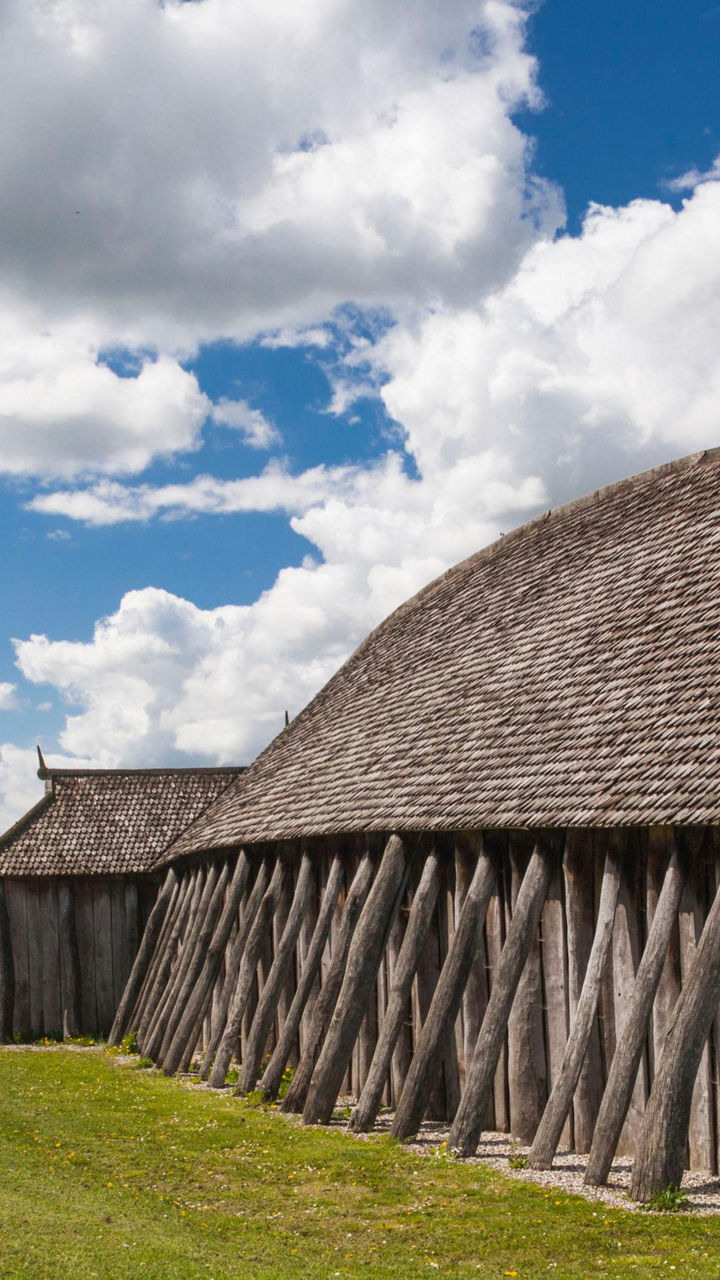 Historic wooden structure under cloudy sky