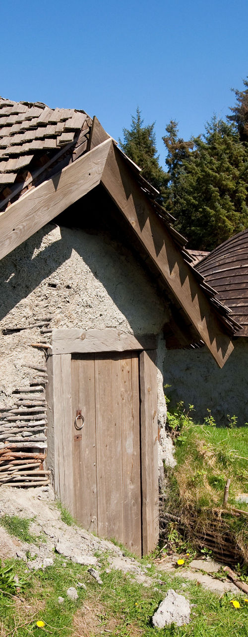Rustic stone cottages in forest clearing
