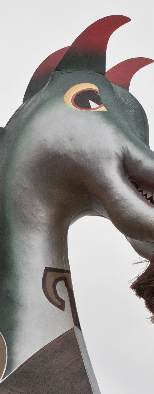 Viking ship dragon figurehead in cloudy sky
