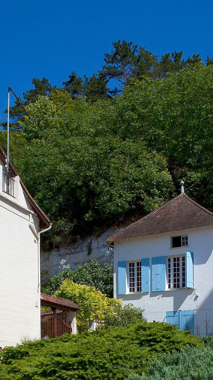Charming village houses with stone monument