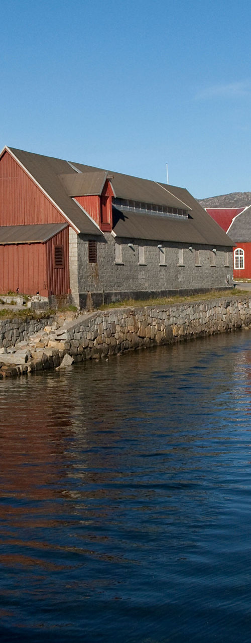 Scenic waterfront with red Nordic buildings