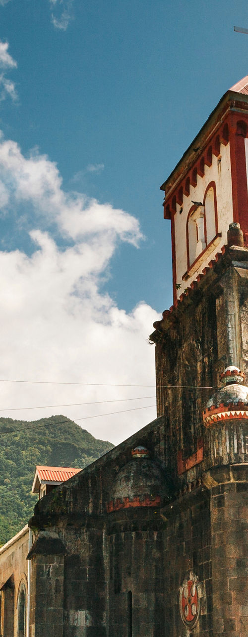 Historic stone church in tropical setting