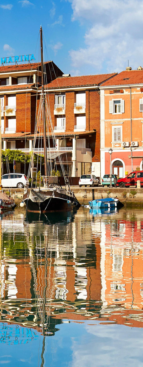 Scenic waterfront with boats and reflections