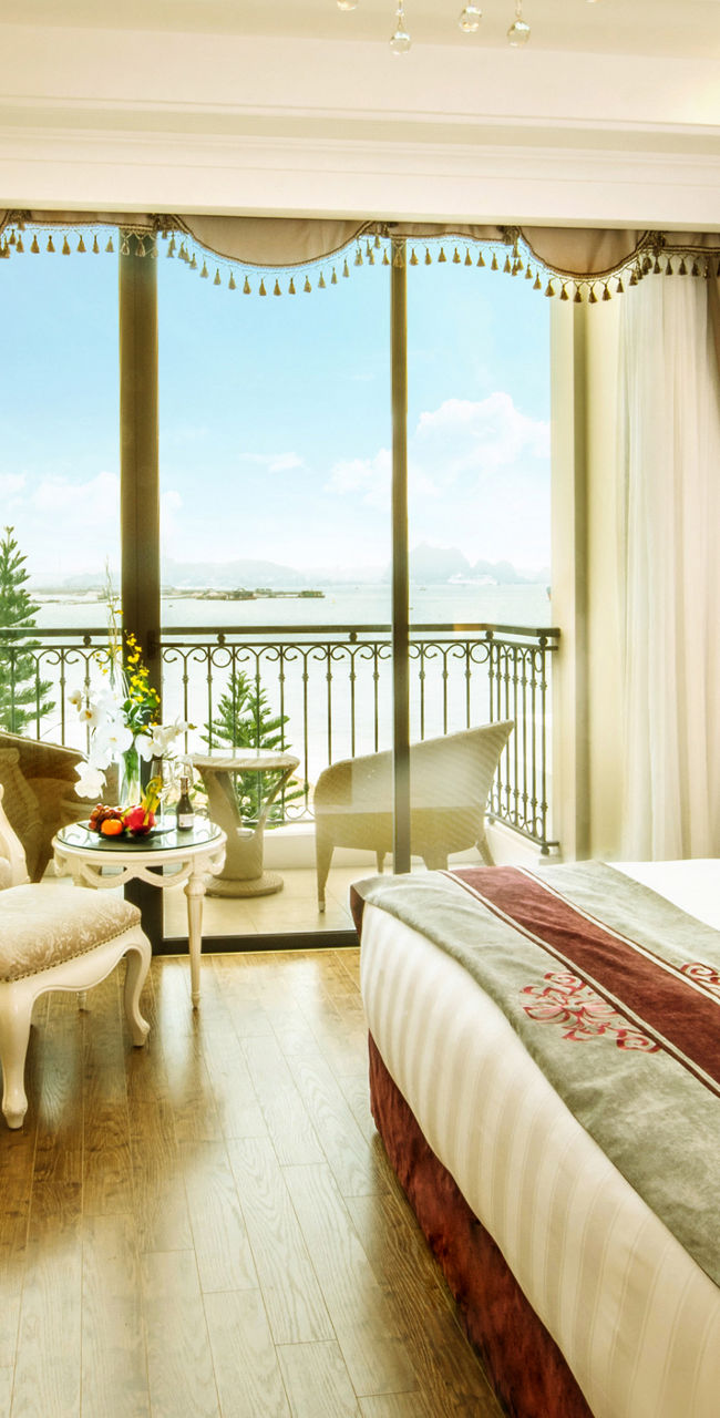 Elegant hotel room with balcony view