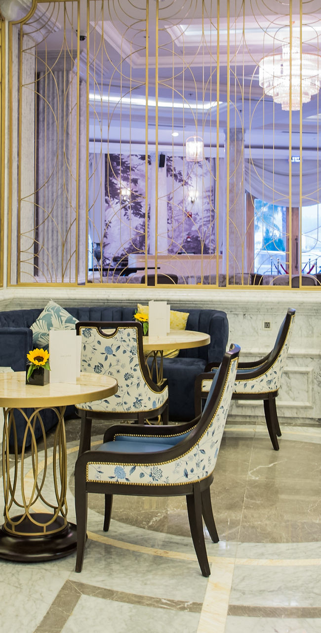 Elegant lounge with gold accents and seating