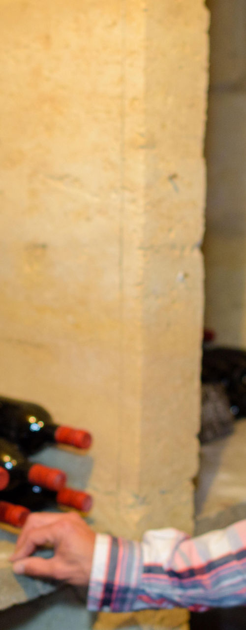 Wine cellar with stacked bottles