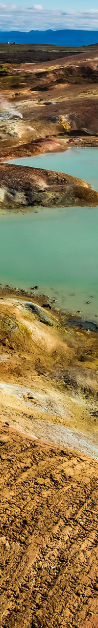 Geothermal landscape with steaming hot springs