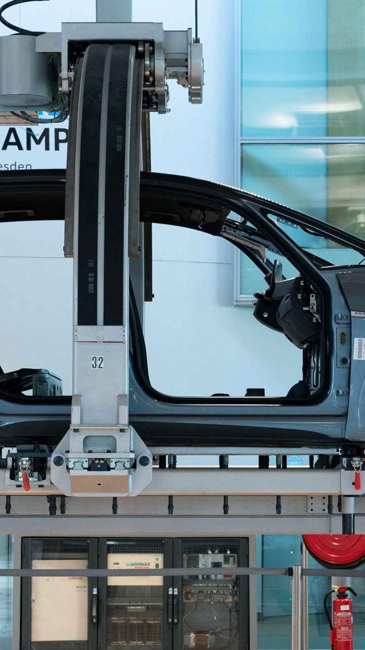 Automobile assembly line with workers in factory