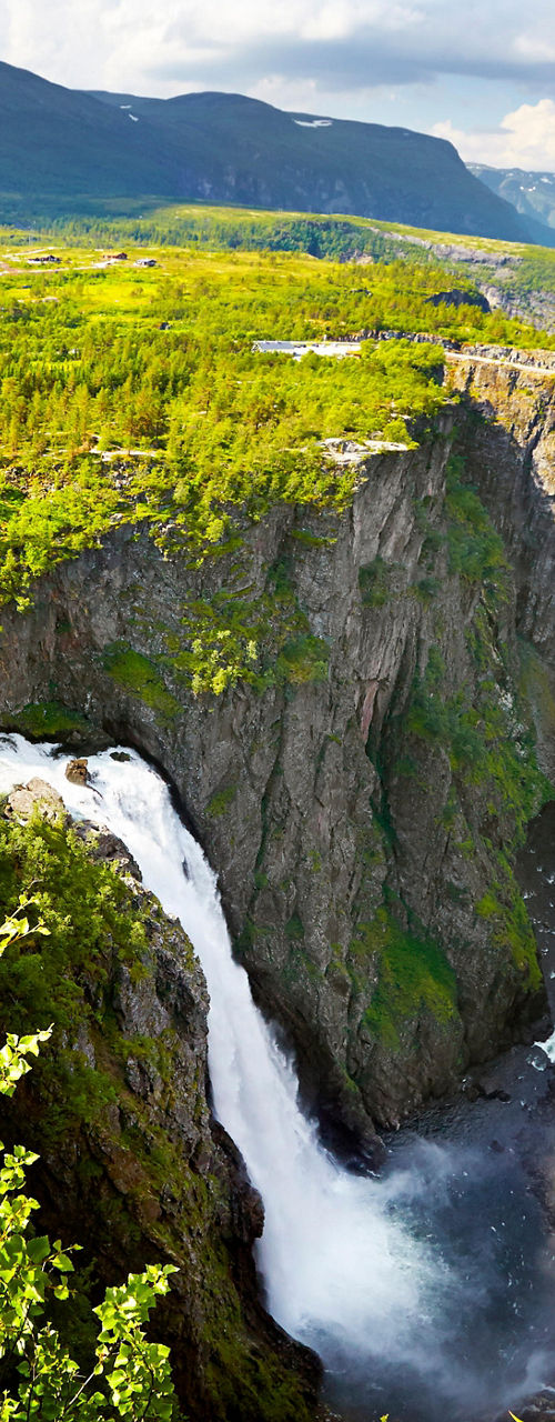 Majestic waterfall in lush mountain valley