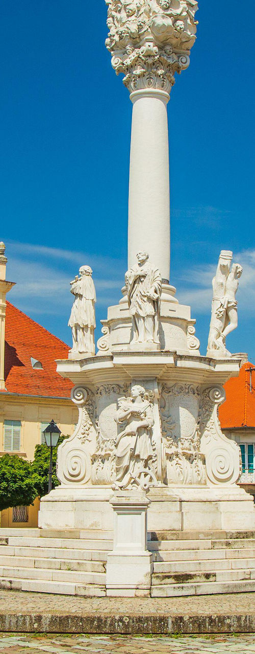 Historic square with ornate column monument