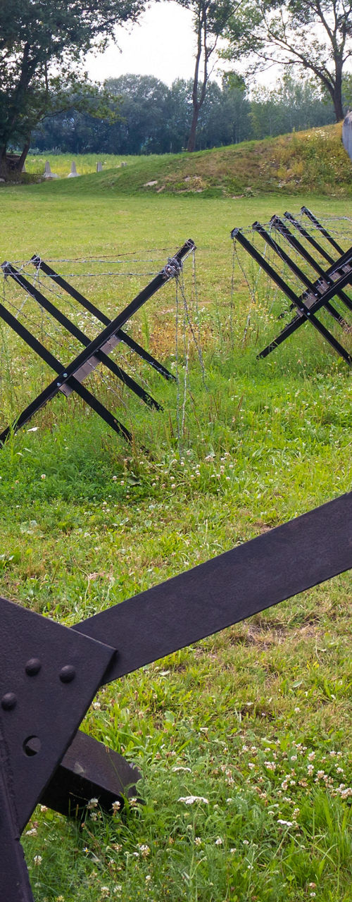 Historic Anti-Tank Obstacles on Grassy Battlefield