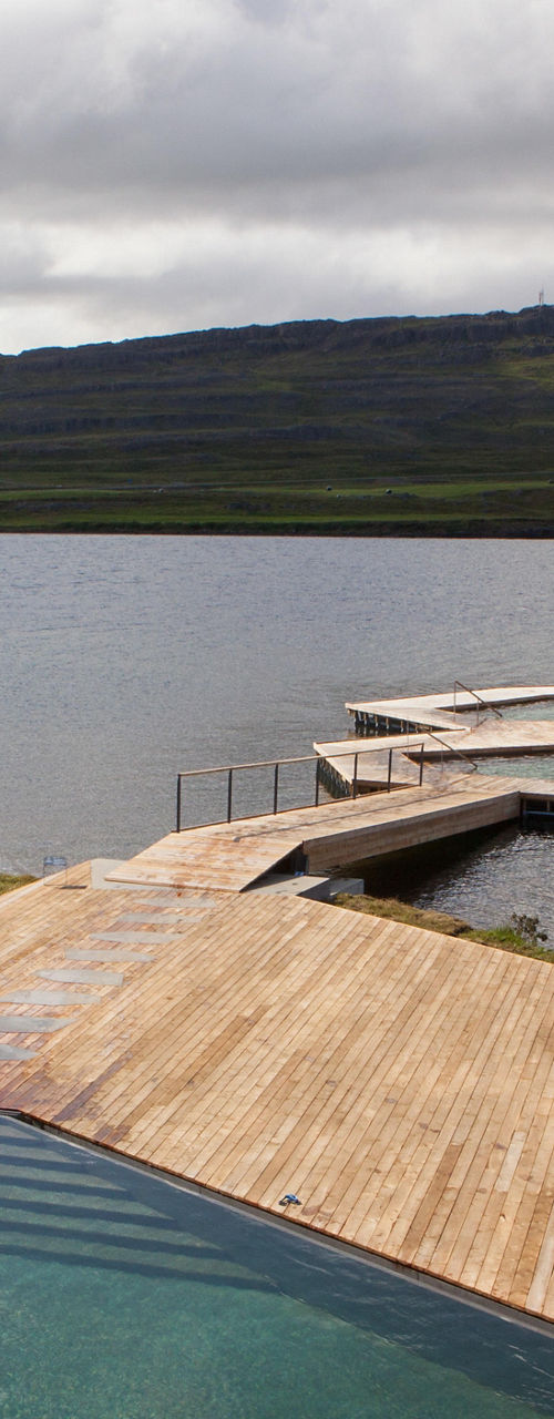 Scenic lakeside geothermal pool with dock