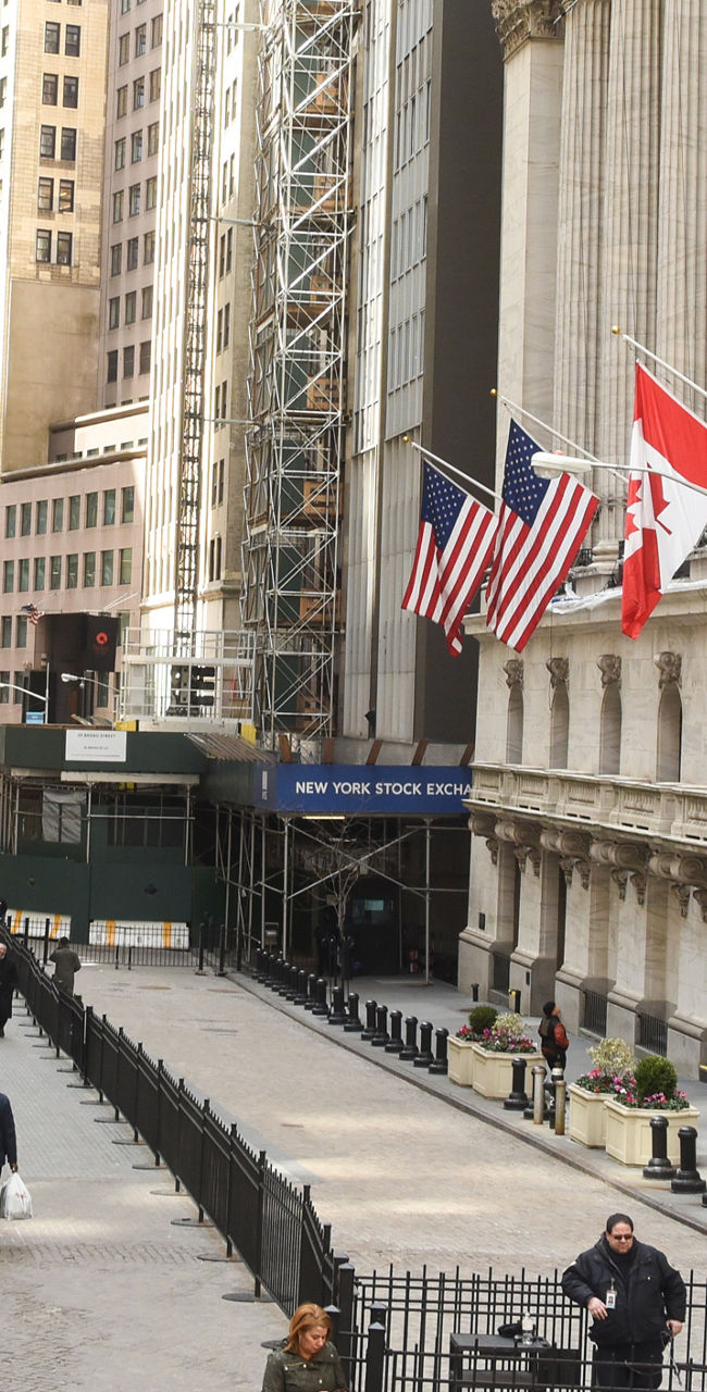 Wall Street financial district with flags