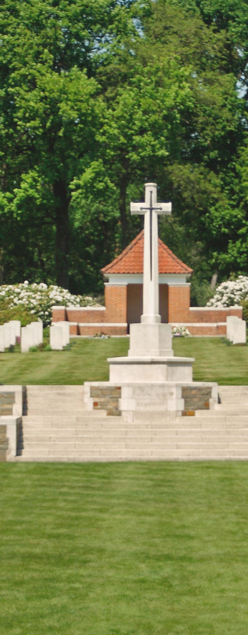 Serene military cemetery with central cross