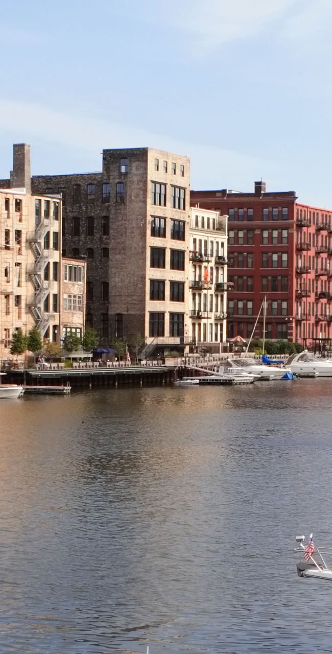Scenic urban waterfront with docked boats