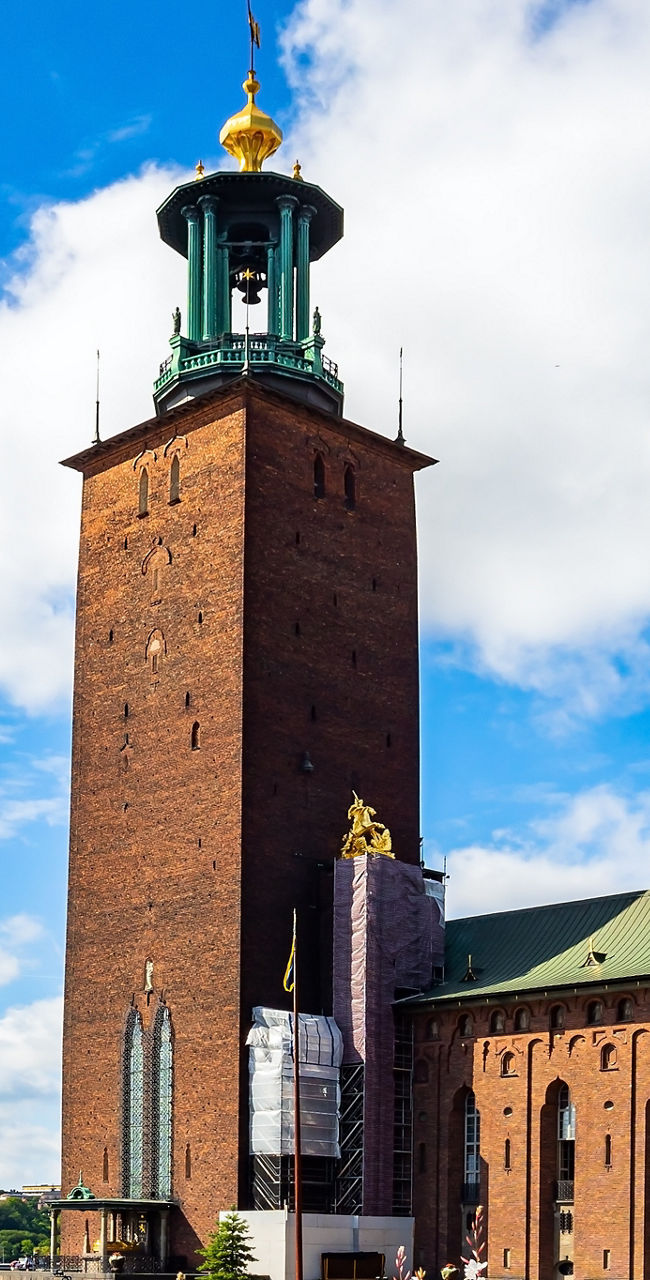 Stockholm City Hall by waterfront on sunny day