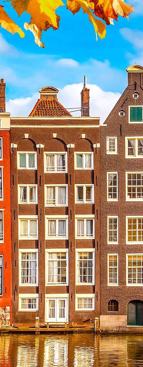 Colorful Amsterdam canal houses in autumn