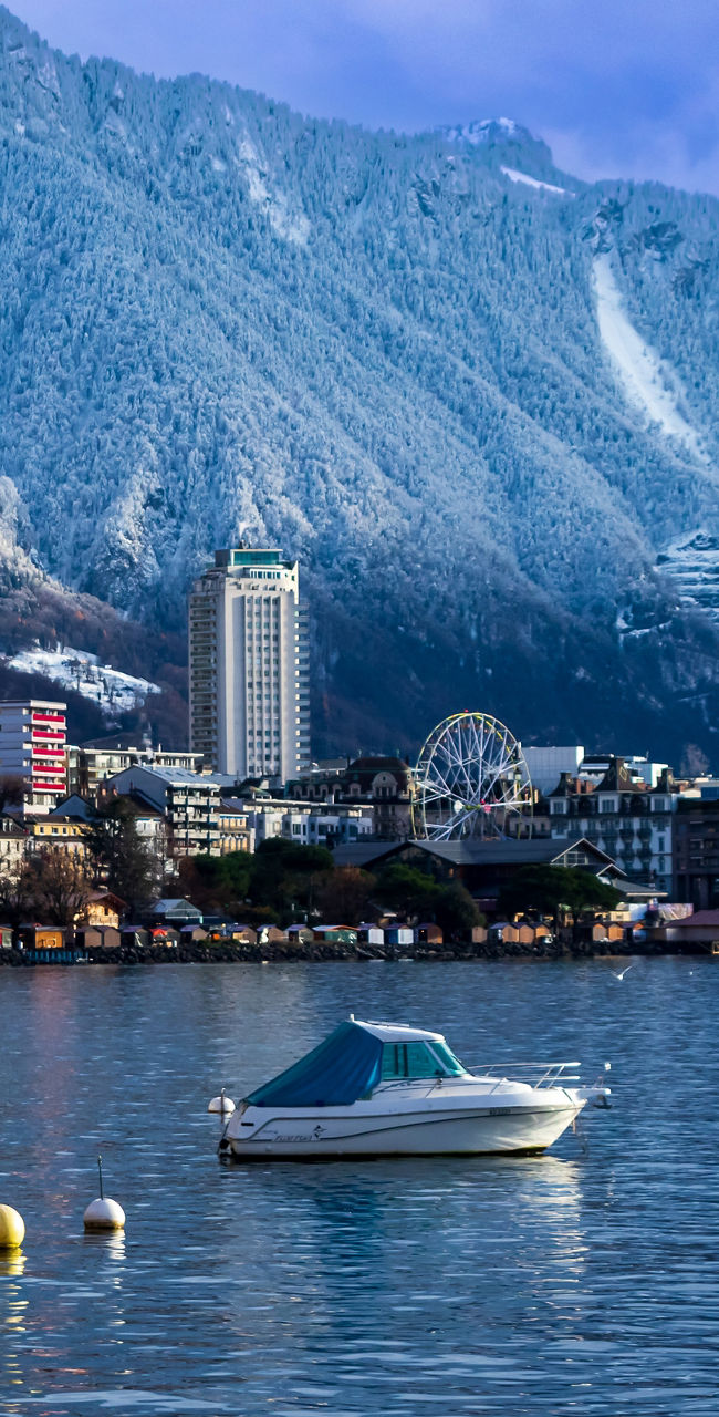 Snowy mountains and lakeside town view