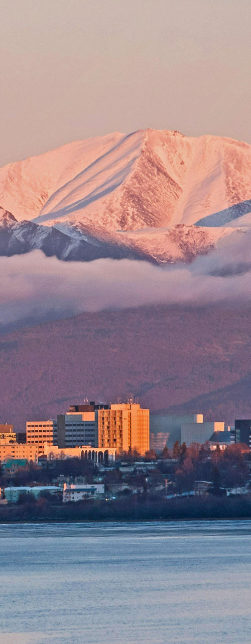 Anchorage skyline with snow-capped mountains