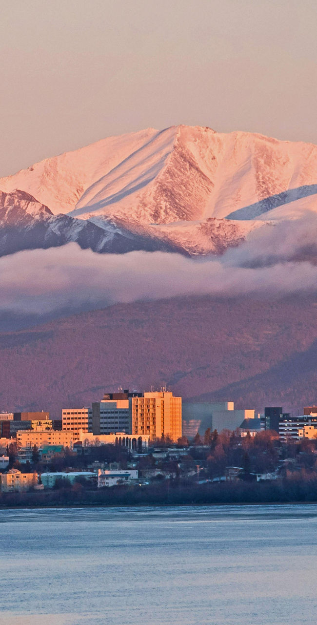 Anchorage skyline with snow-capped mountains