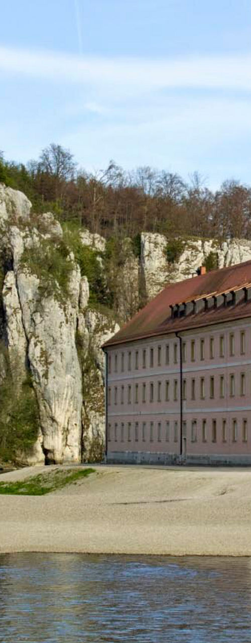 Historic riverside monastery with scenic cliffs