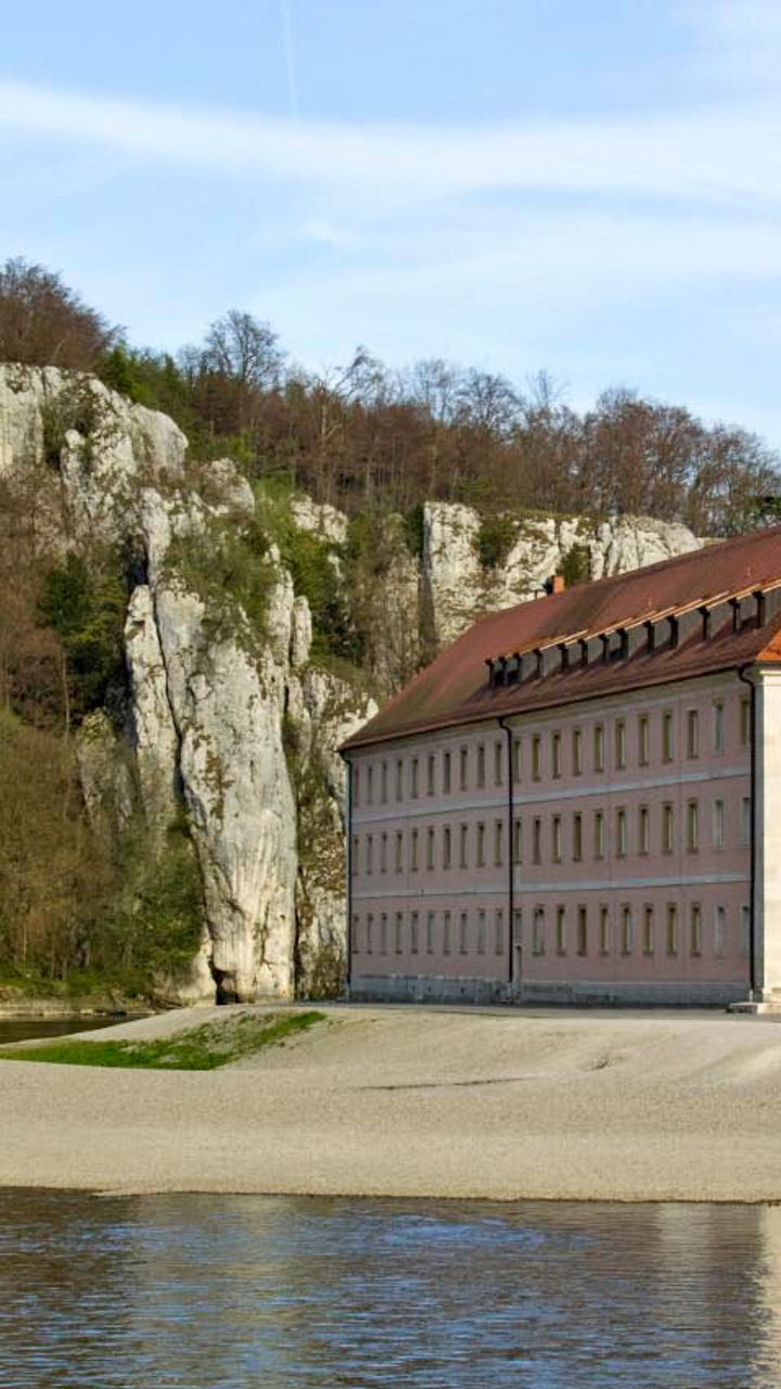 Historic riverside monastery with scenic cliffs