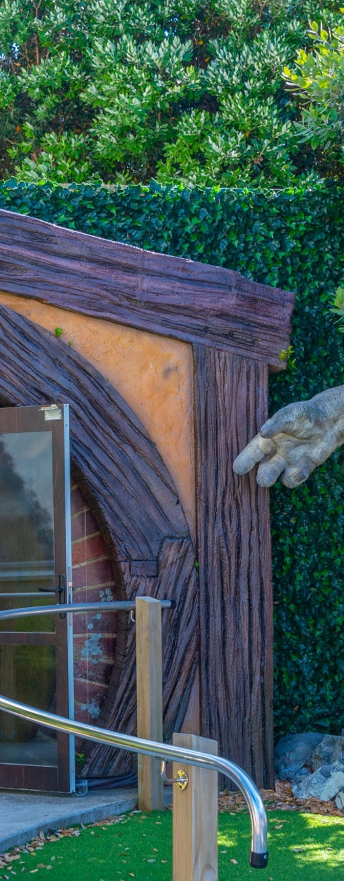 Fantasy-themed entrance with troll statue