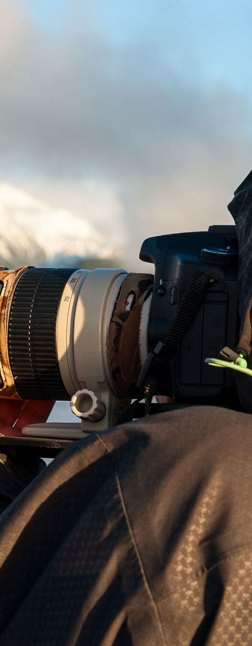 Photographer with Canon camera in nature
