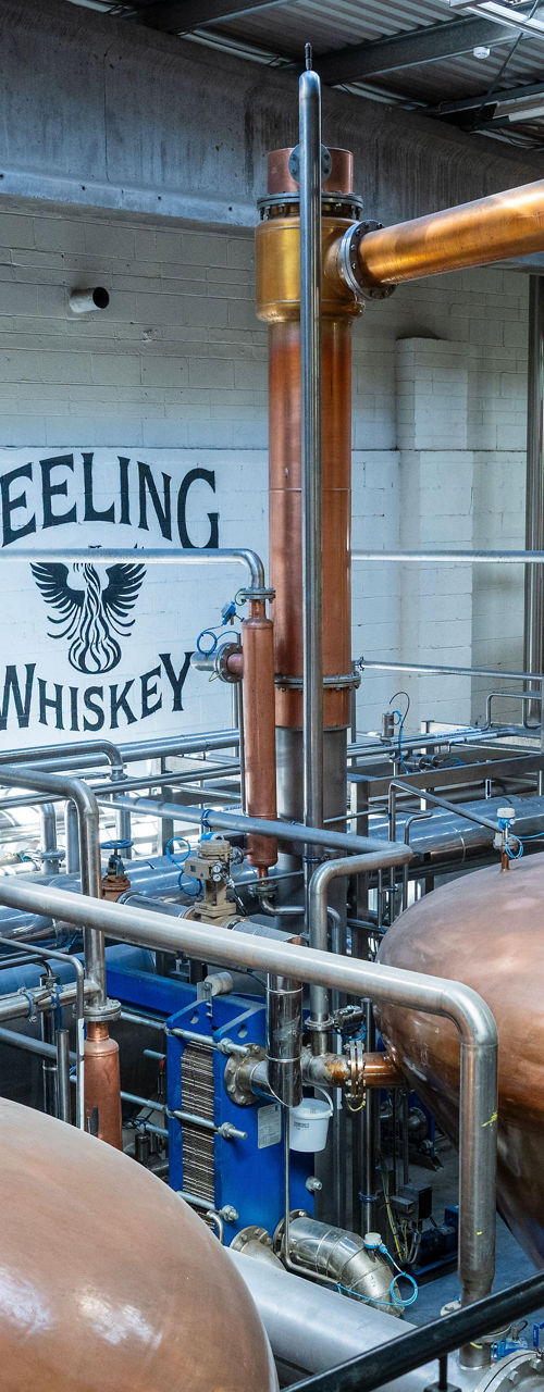 Copper whiskey stills inside Teeling distillery