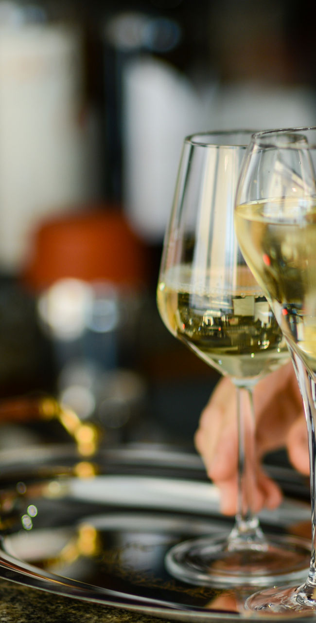 Two wine glasses on elegant tray