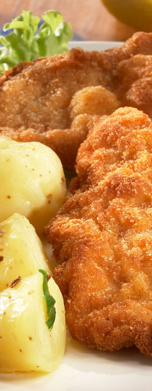Crispy breaded schnitzel with potatoes