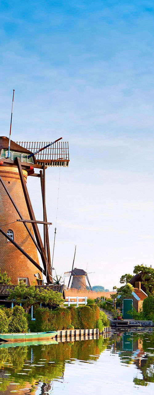 Historic windmills by a serene canal