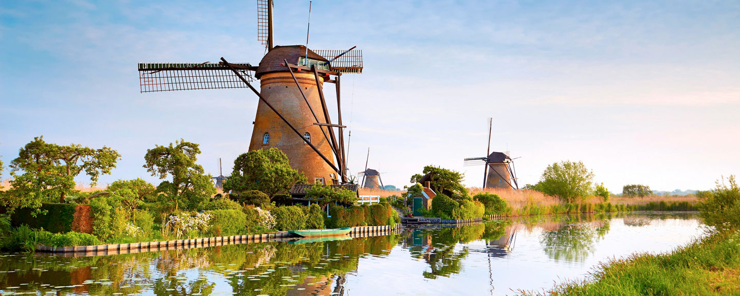 Historic windmills by a serene canal