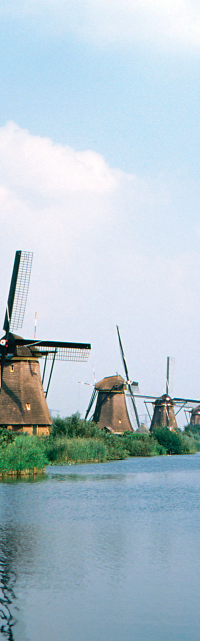 Historic windmills by a serene canal