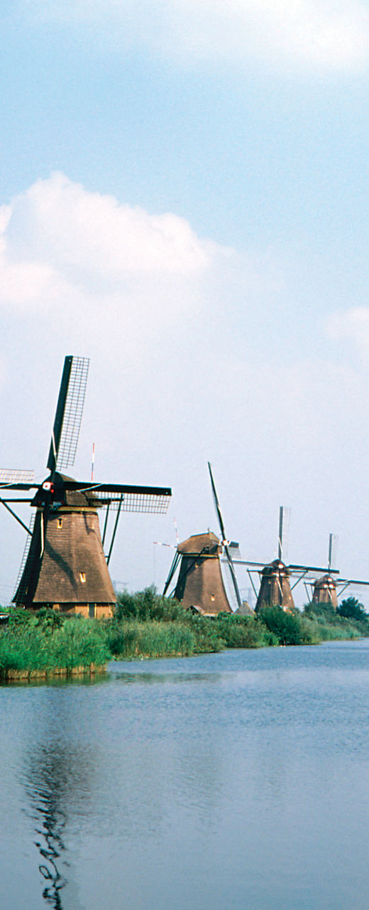 Historic windmills by a serene canal
