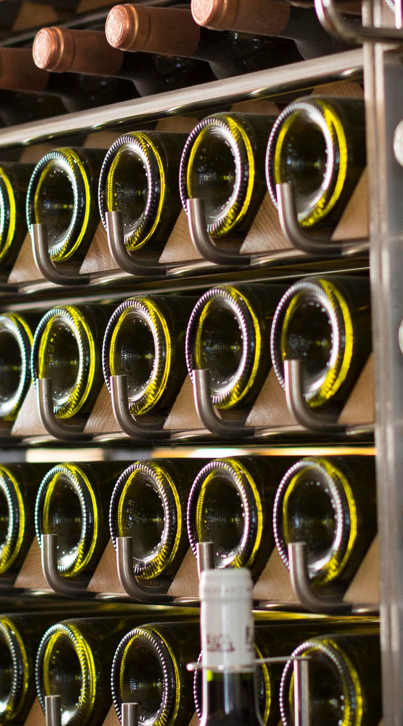 Wine bottles on modern storage rack