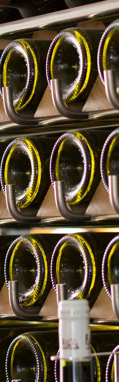 Wine bottles on modern storage rack