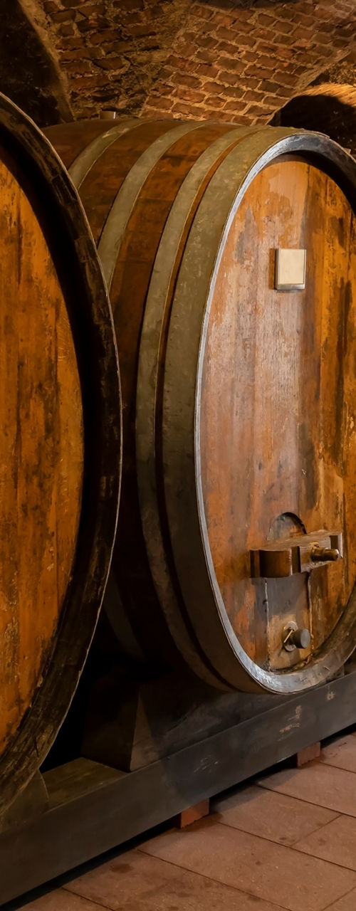 Rustic wine barrels in stone cellar