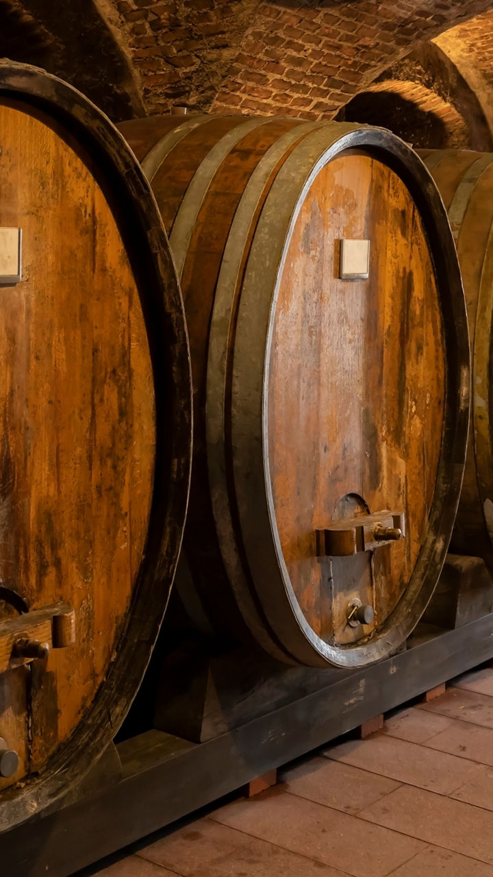 Rustic wine barrels in stone cellar
