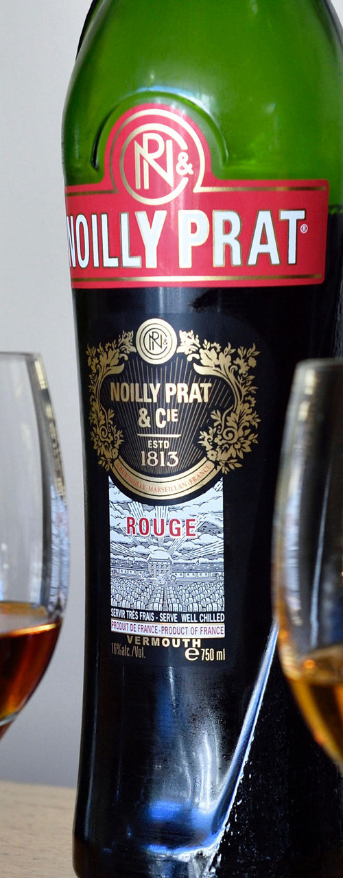 Noilly Prat vermouth bottles with glasses