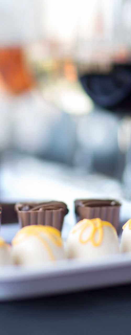 Assorted chocolates with wine glasses