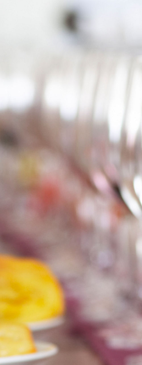 Wine glasses on table with pastries