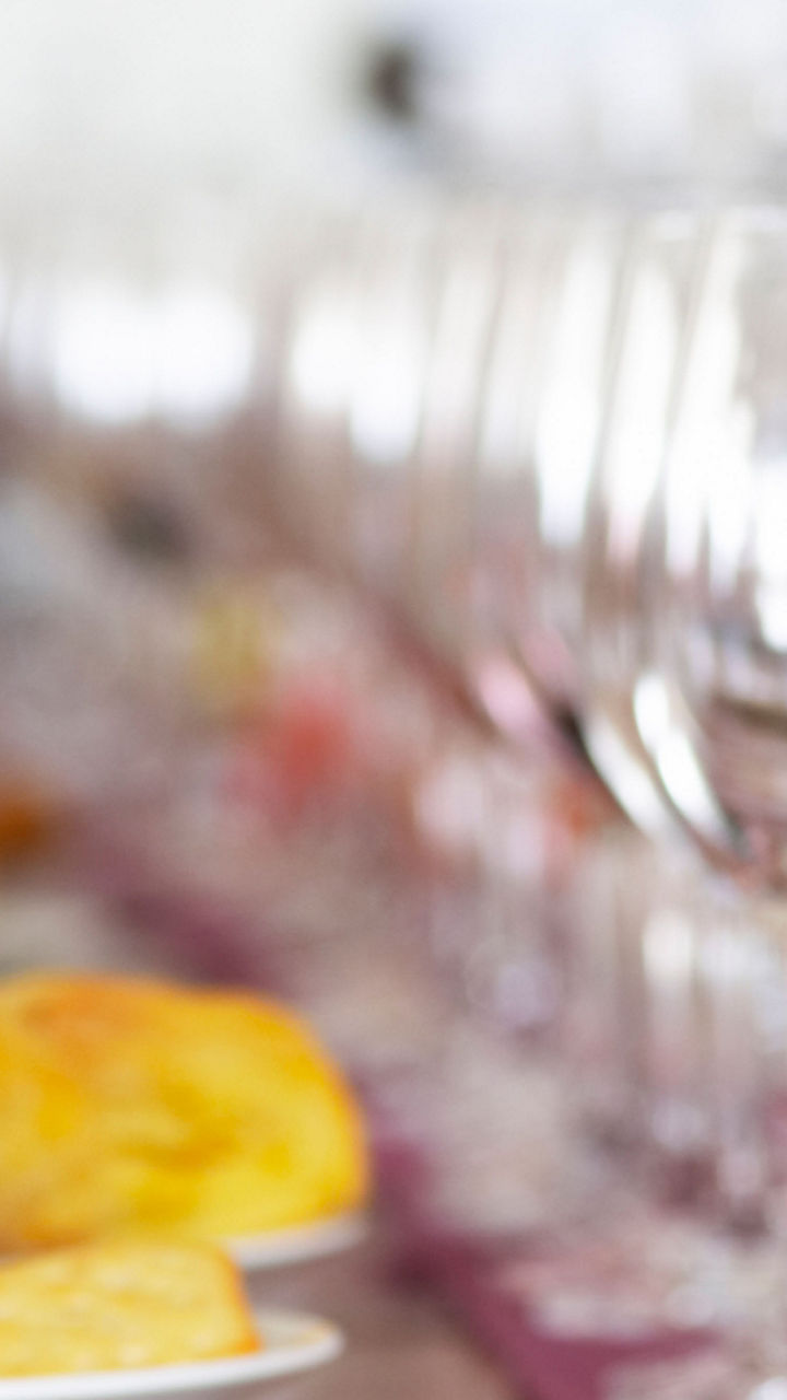 Wine glasses on table with pastries