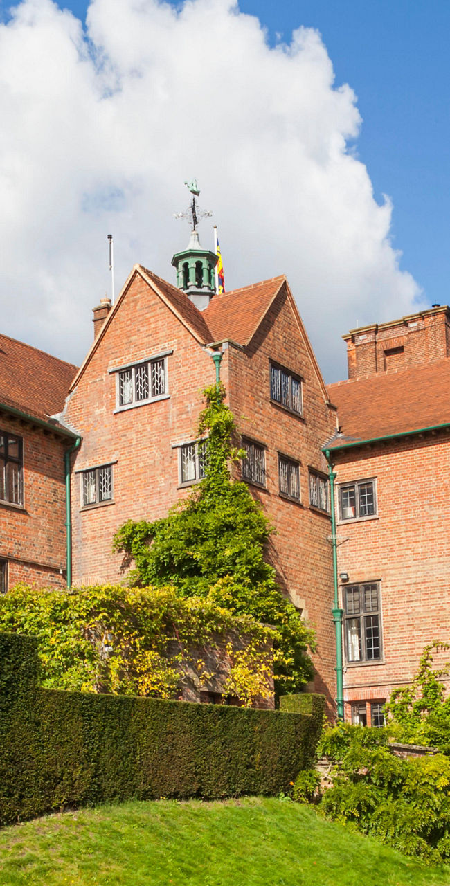 Historic brick mansion with lush gardens
